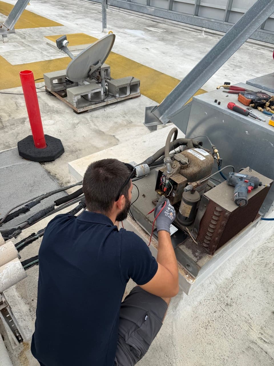 Technician performing AC replacement