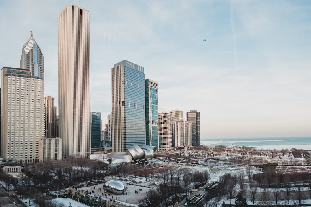 Heat pump outdoor unit operating during Chicago winter with snow accumulation